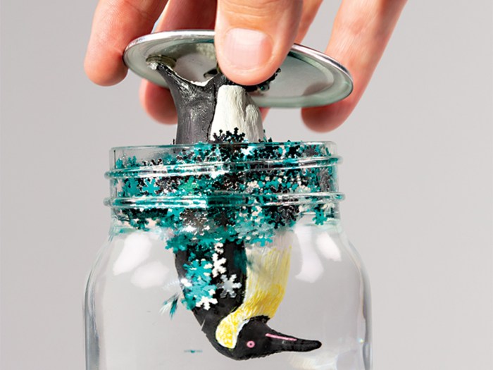 put the figurine and lid on the jar to finish the snow globe